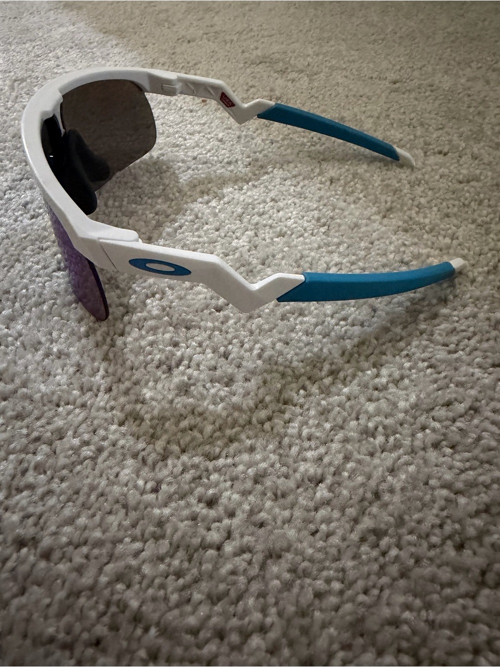 Oakley White Frame Sunglasses with Blue Temples and Purple Lenses